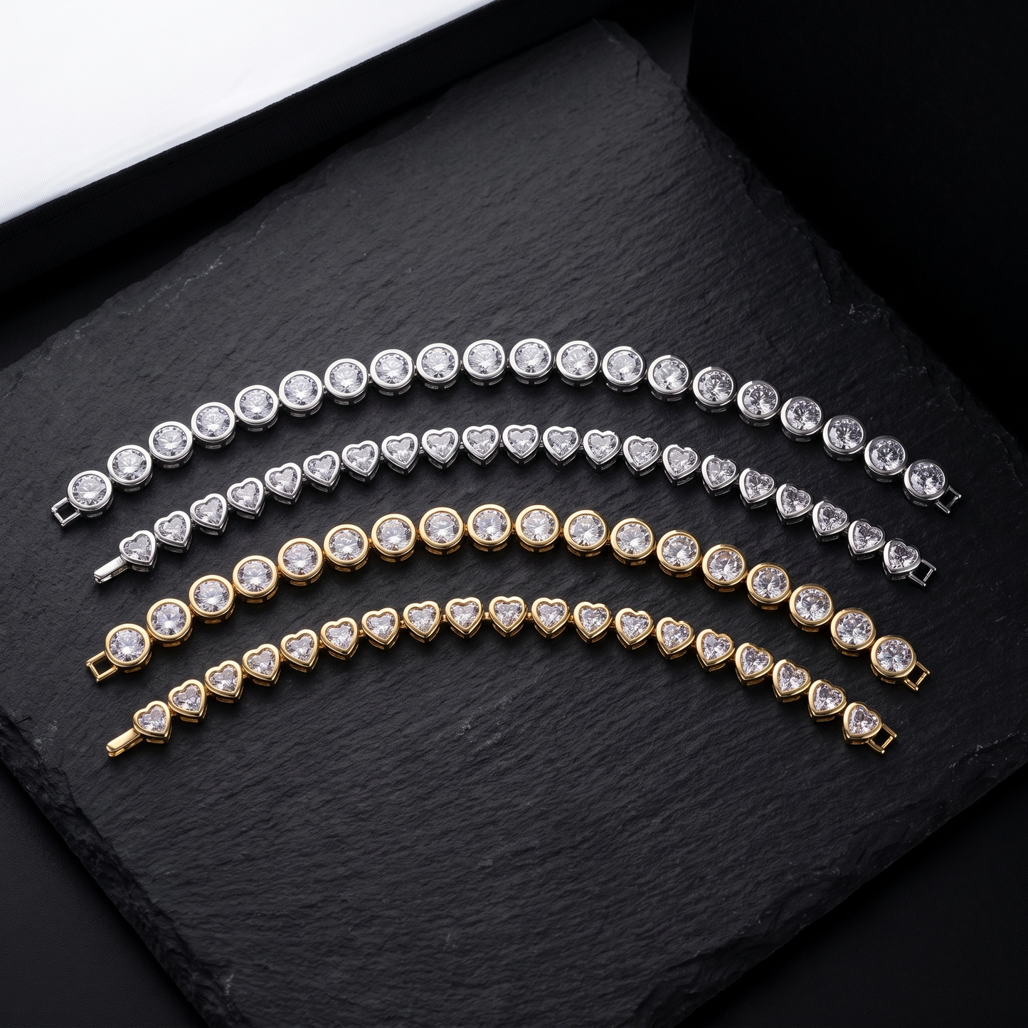Bezel CZ tennis bracelet shown in round and heart, silver and gold