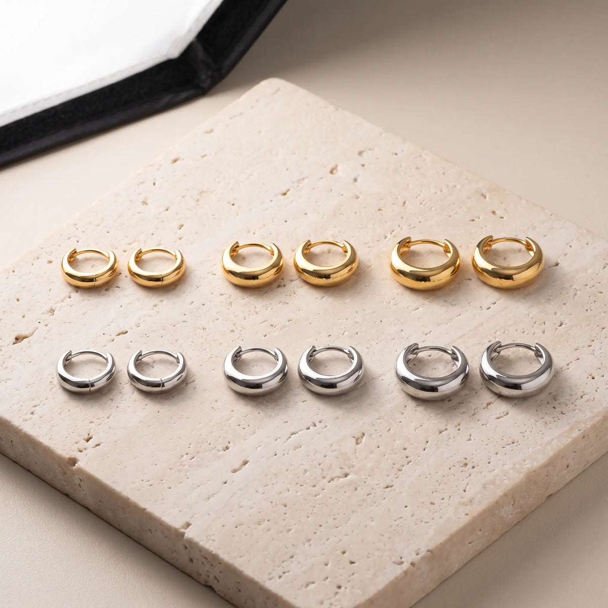 Huggie hoops shown in 6, 10, 12mm, gold and silver