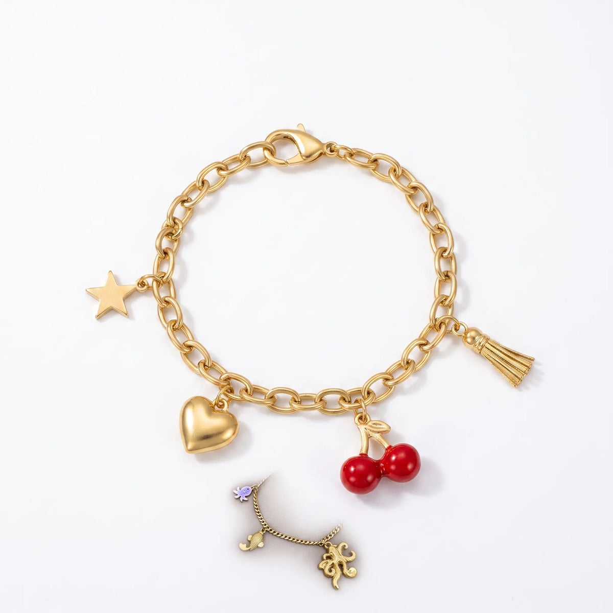 Star heart cherry tassel bracelet shown laid flat