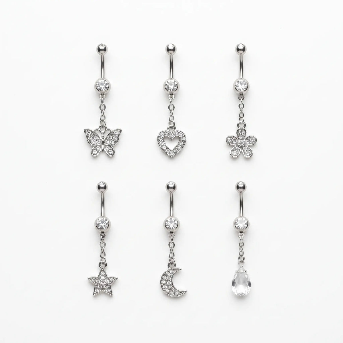 Six dangle belly ring styles laid out
