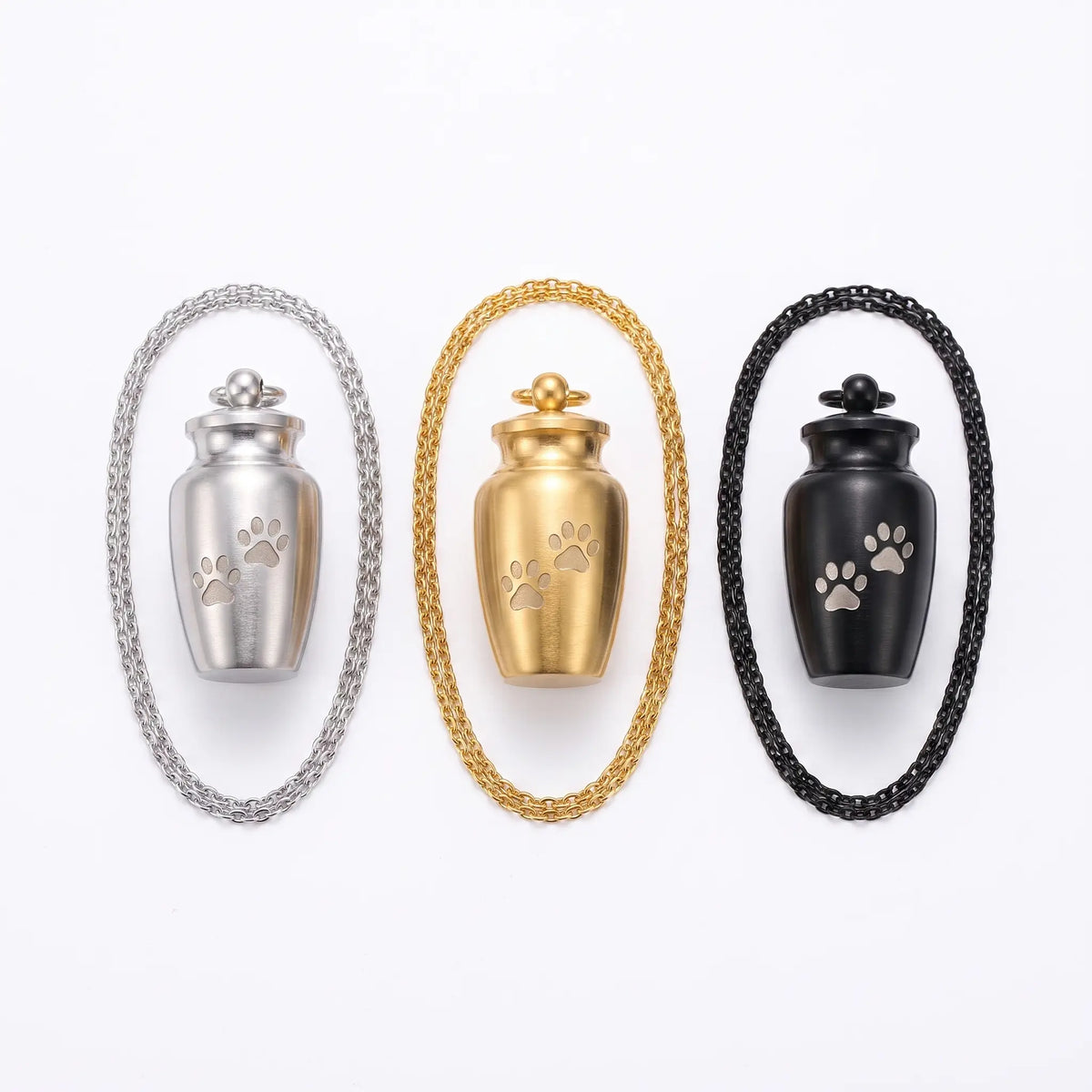 Urn pendant shown in silver, gold, black