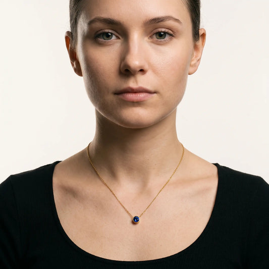 Birthstone pendant necklace worn, front view