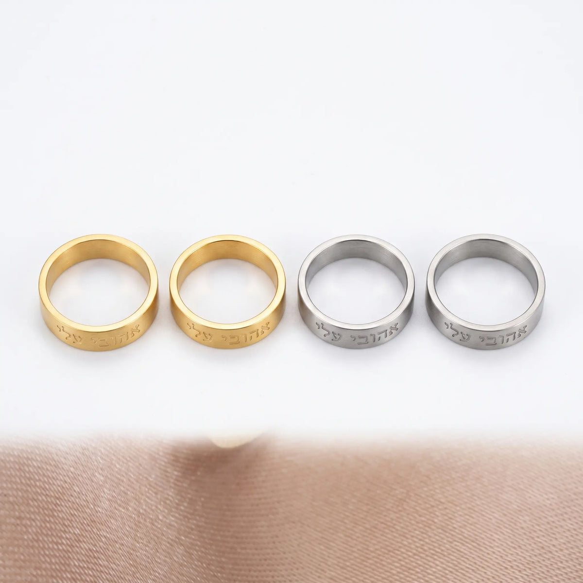 Hebrew band ring shown in four finishes