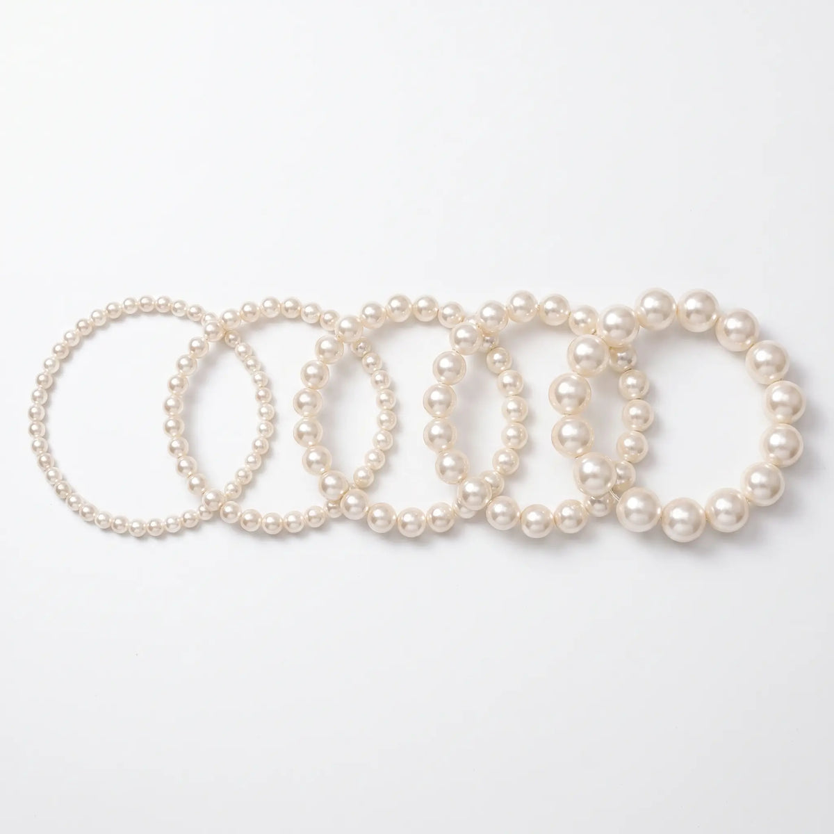 Pearl chokers shown in five bead sizes