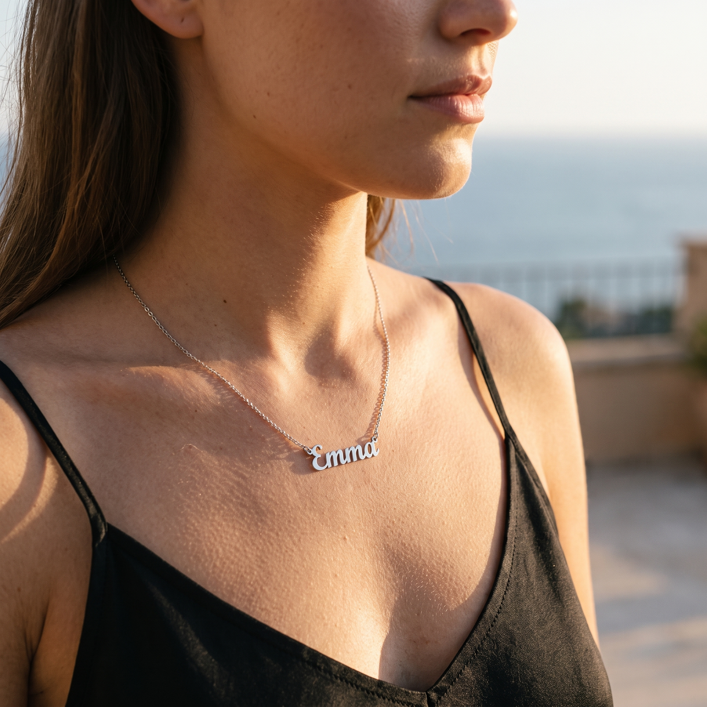 Cursive name necklace worn, front view