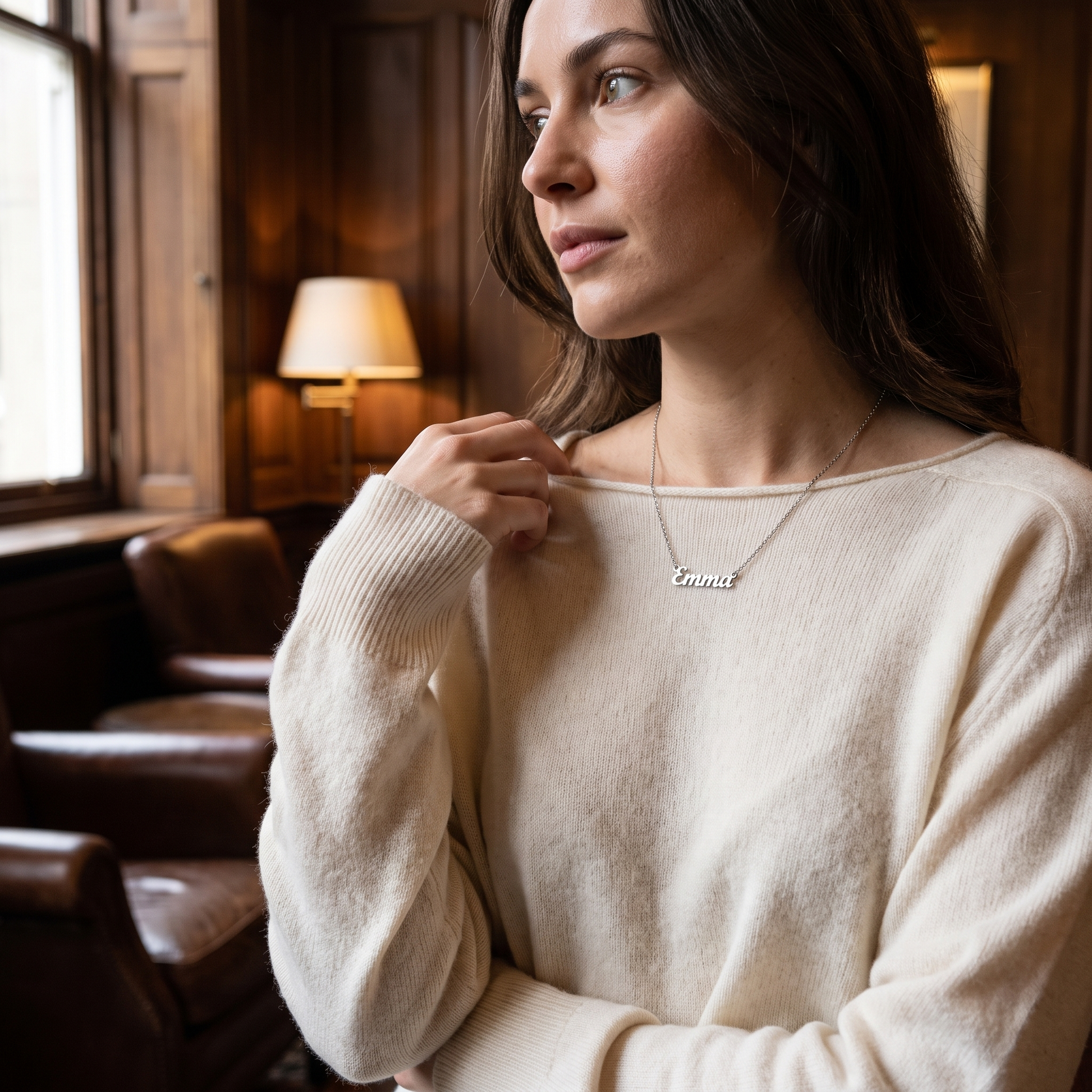 Cursive name necklace worn, second angle