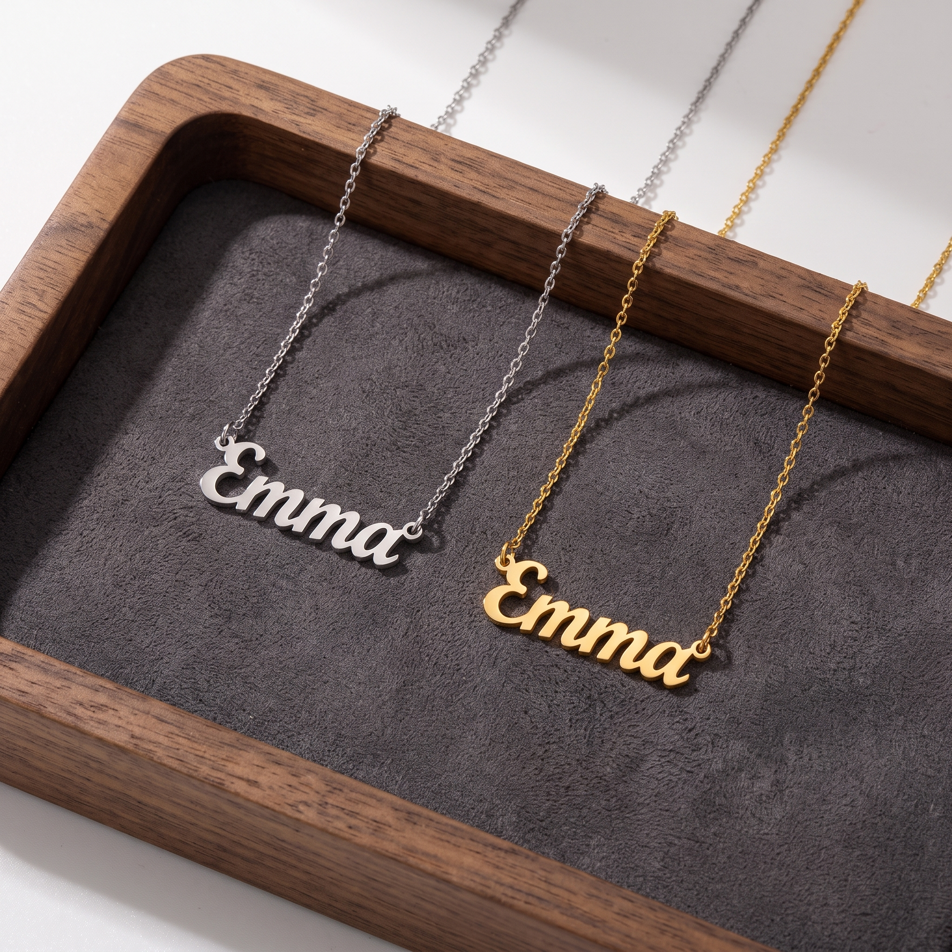 Name necklace shown in silver and gold finishes