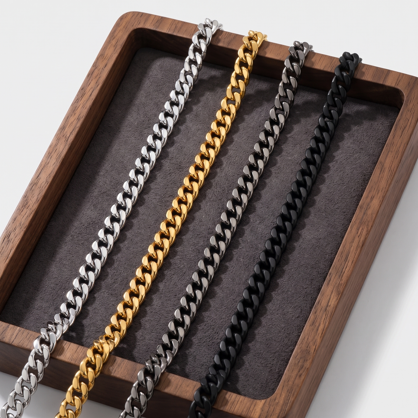 Cuban chain shown in silver, gold, gunmetal and black