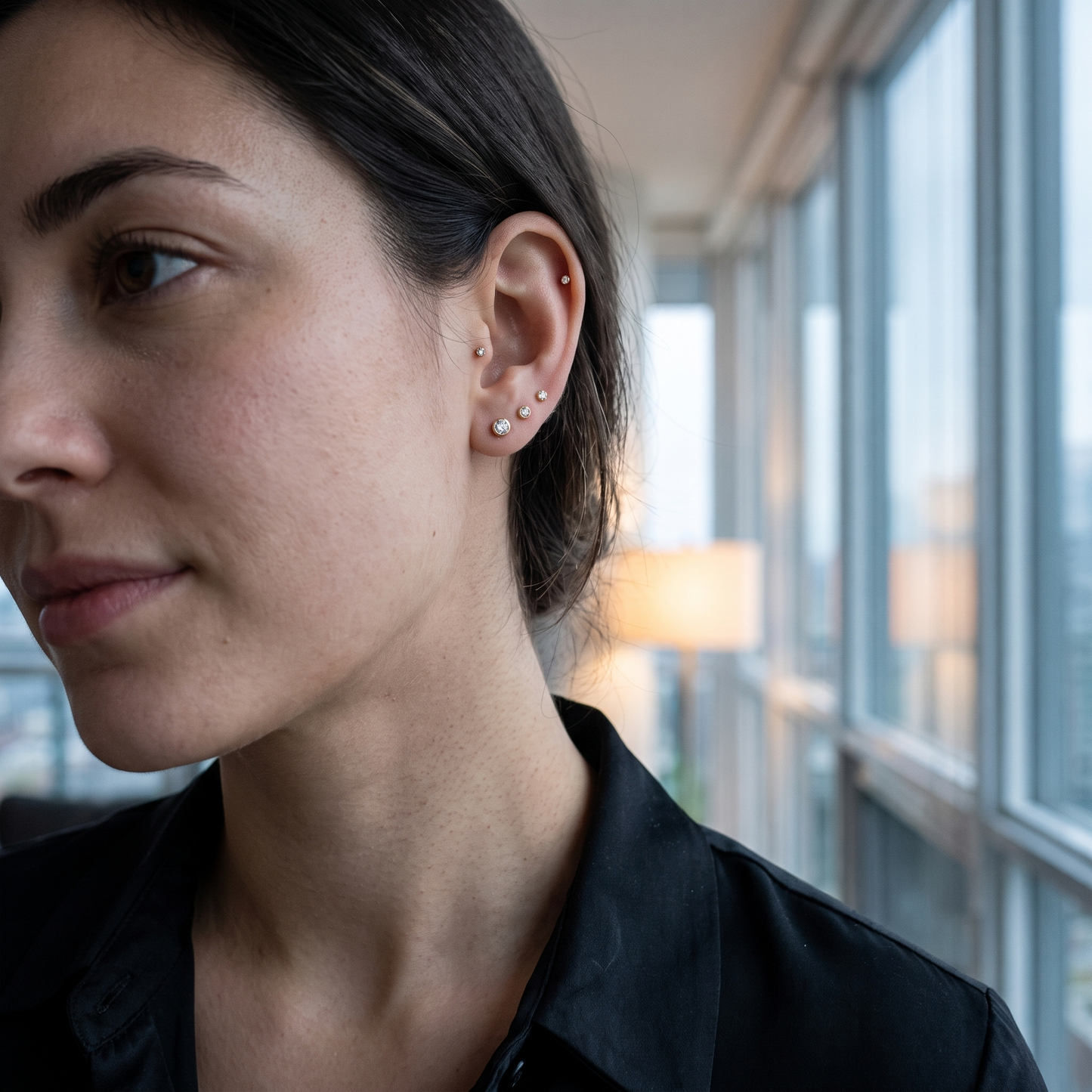 Stacked flat-back CZ studs worn in the ear