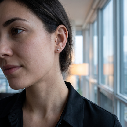 Stacked flat-back CZ studs worn in the ear