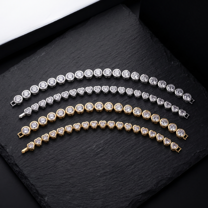 Bezel CZ tennis bracelet shown in round and heart, silver and gold