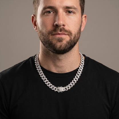 Man wearing the Iced Out 14MM Prong Cuban Link Chain, studio portrait