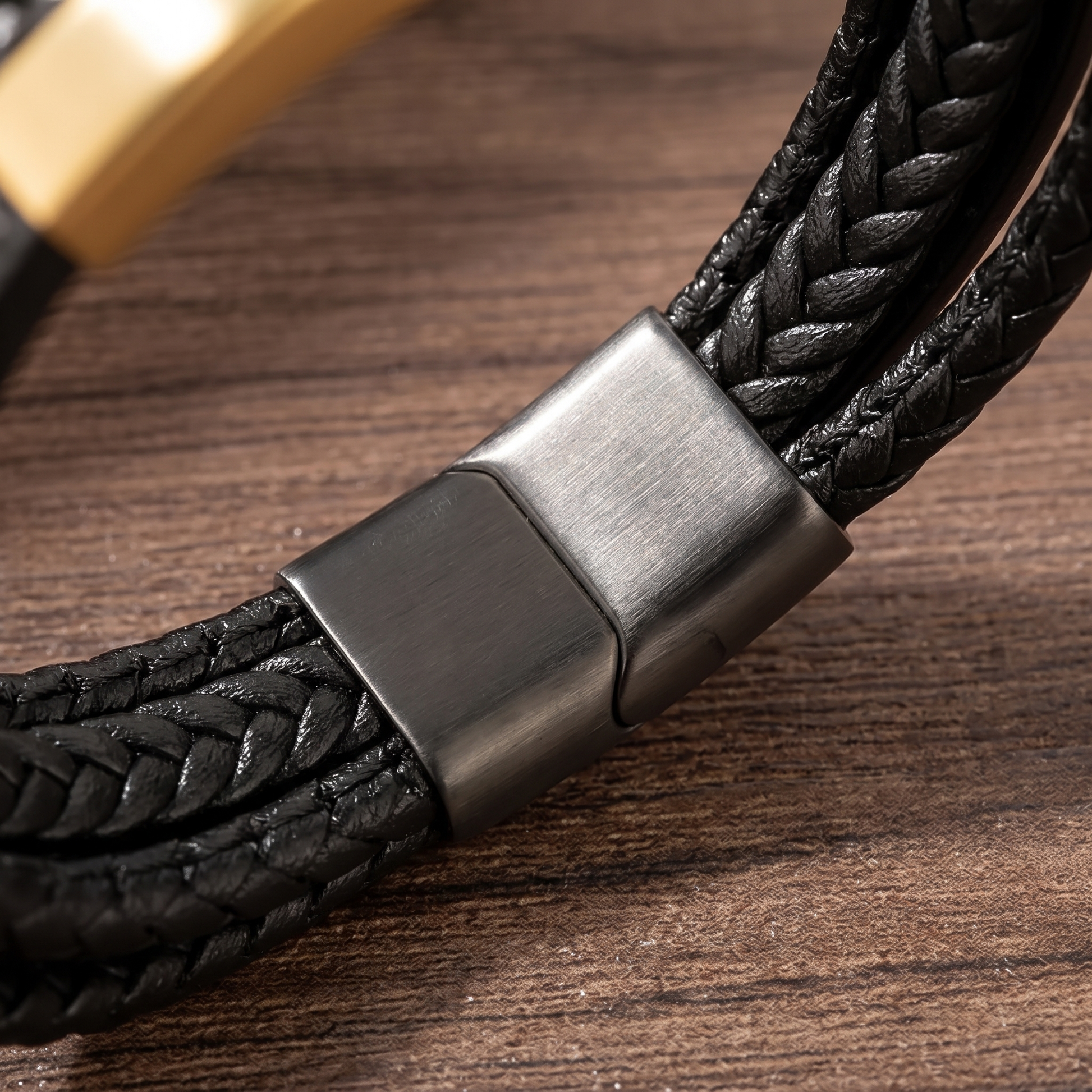 Close-up of the braid and gunmetal magnetic clasp