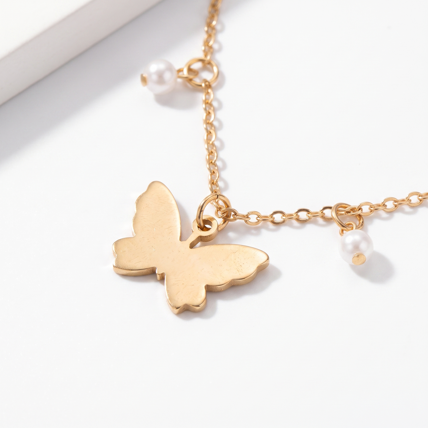 Close-up of anklet charms