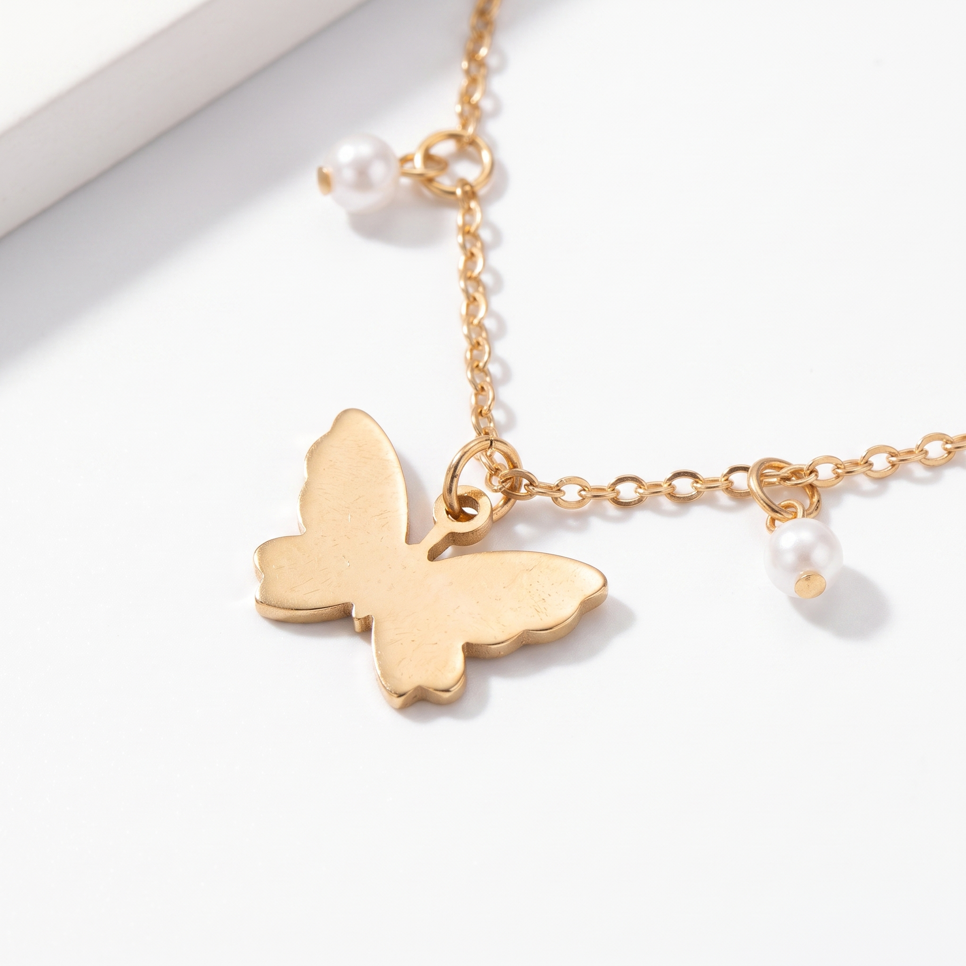 Close-up of anklet charms