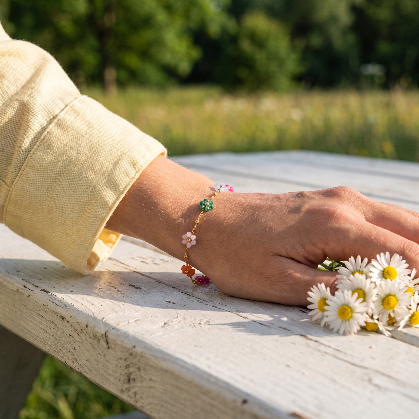 Enamel flower bracelet worn, second angle