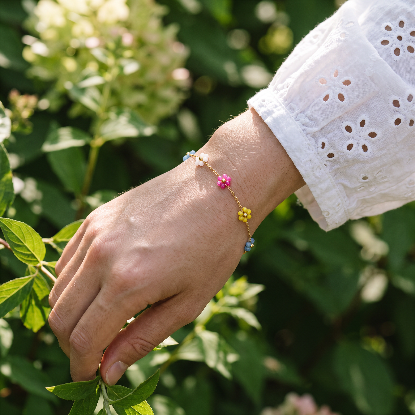 Enamel flower bracelet worn, front view