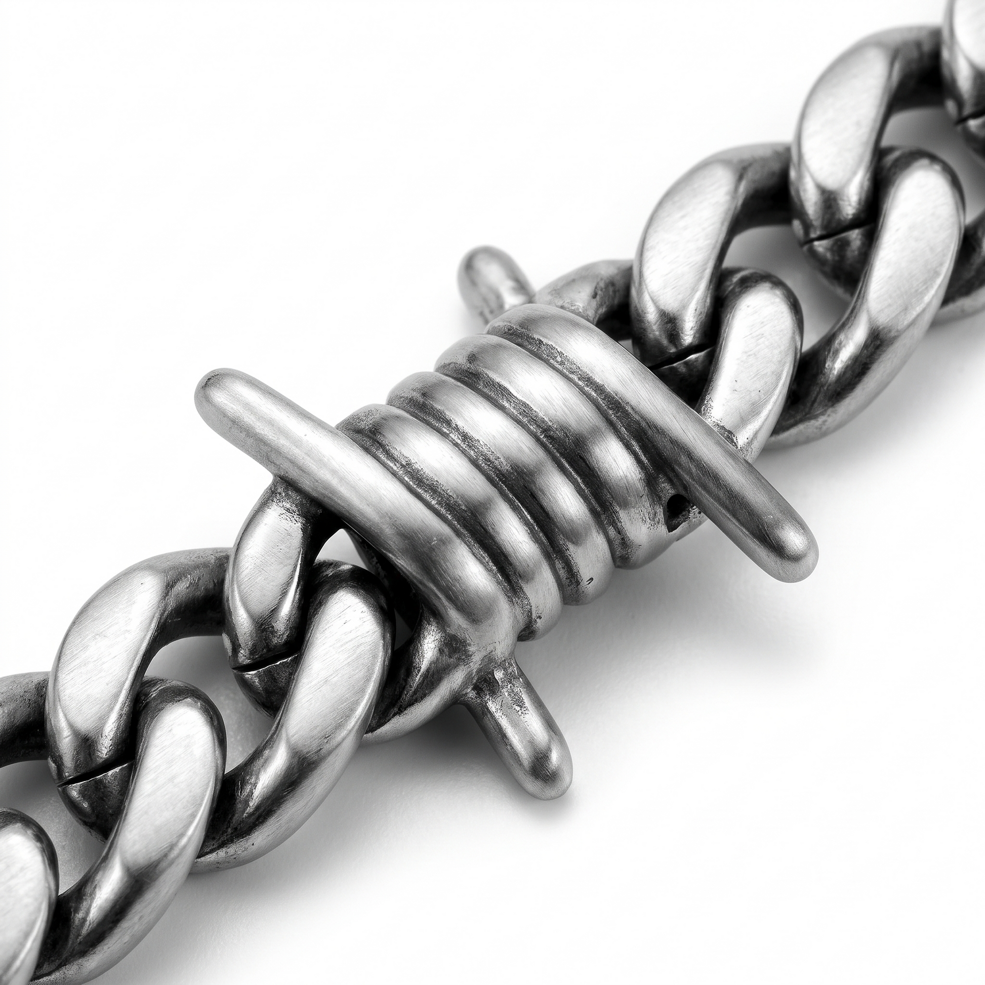 Close-up of barbed wire links
