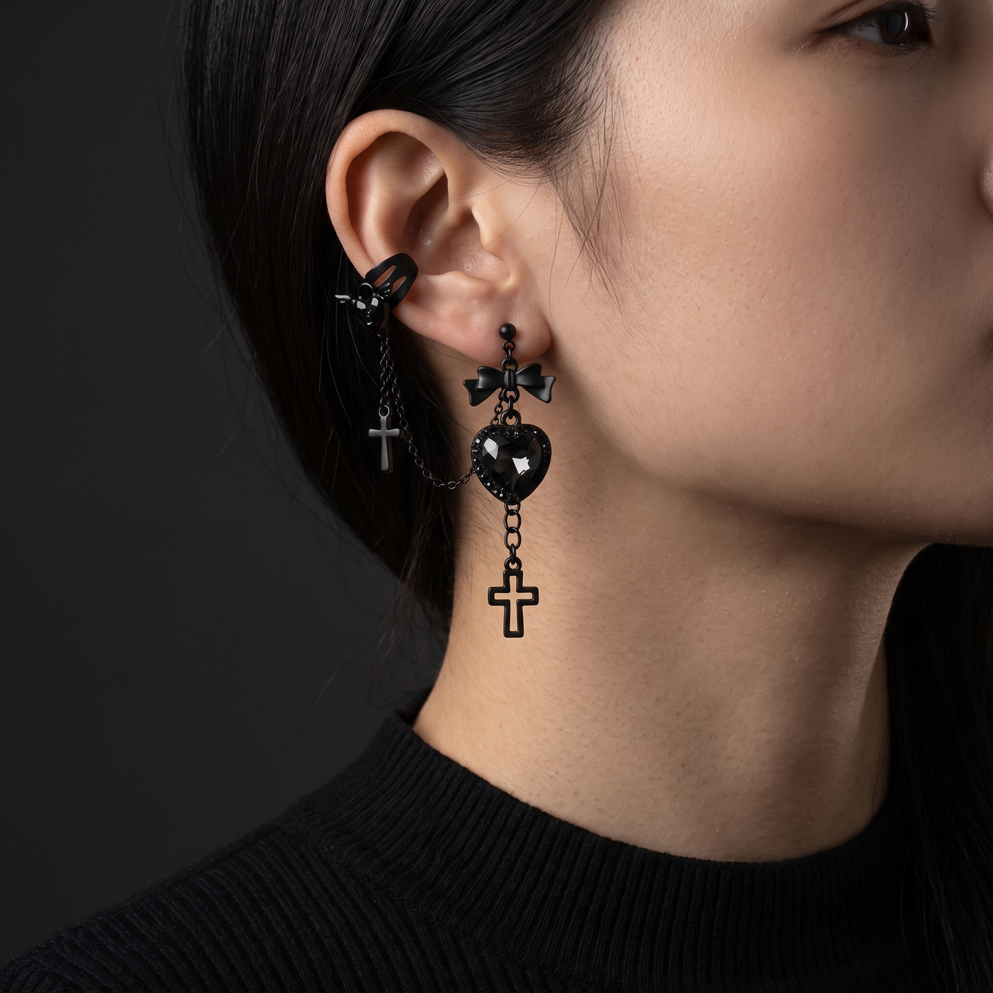 Gothic heart cross ear cuff worn, front view