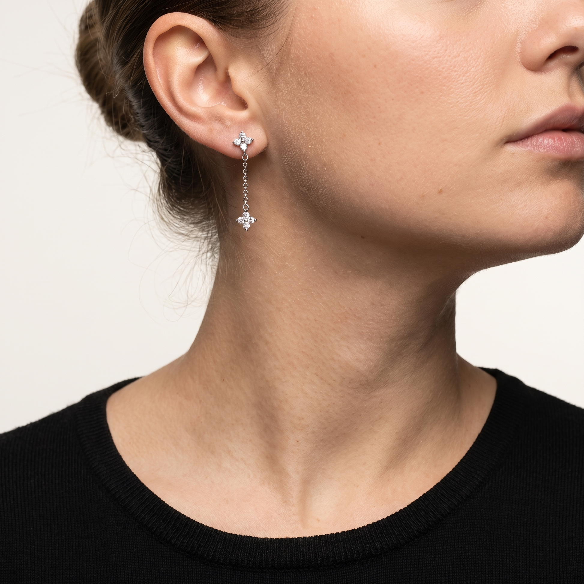 Crystal flower drop earrings worn, front view