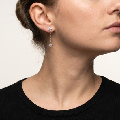 Crystal flower drop earrings worn, front view
