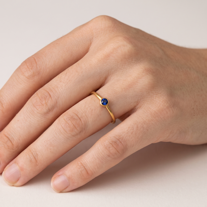 Birthstone ring worn, front view