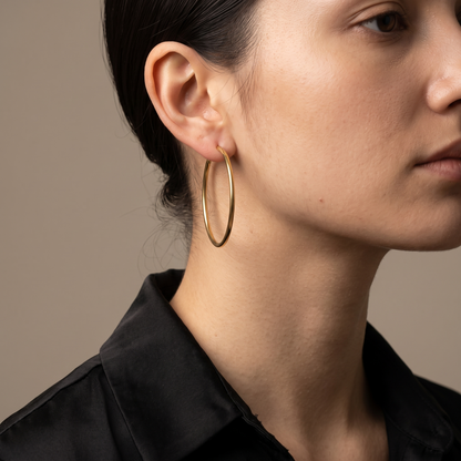 Big circle hoop earrings worn, front view
