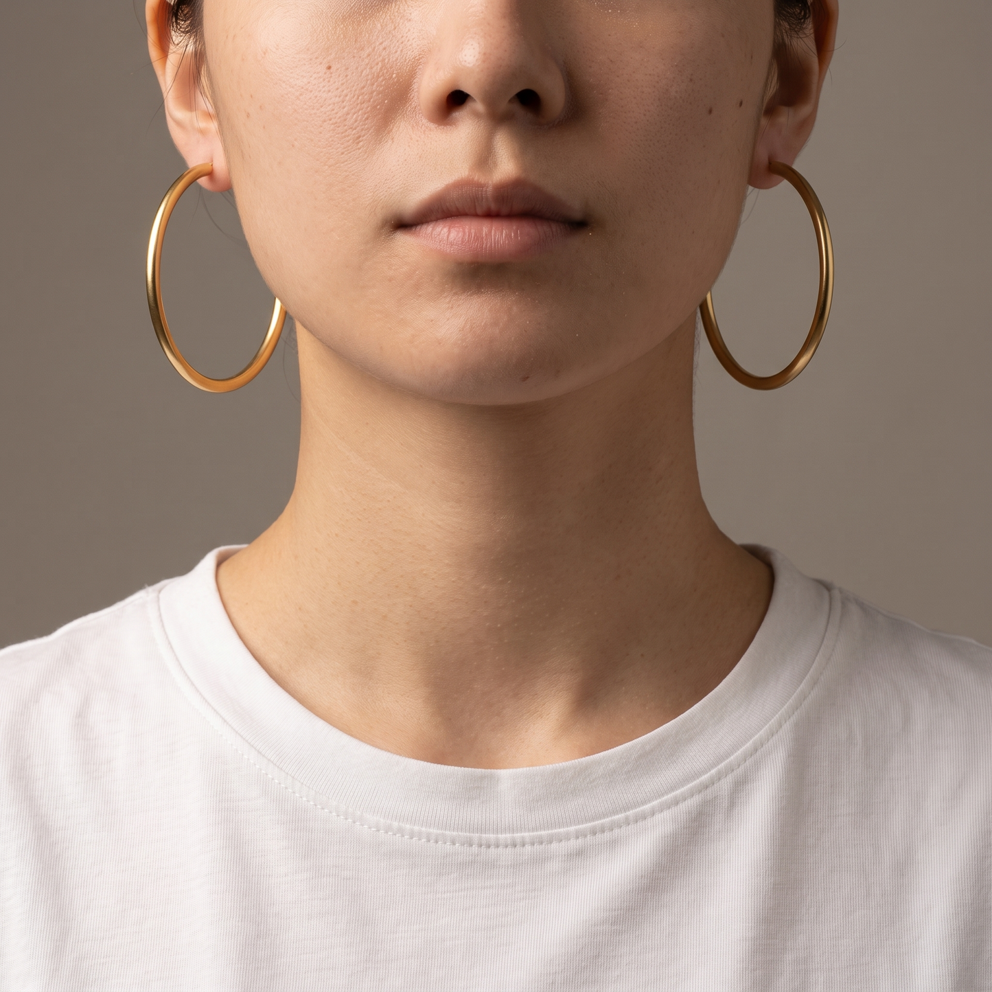 Big circle hoop earrings worn, second angle