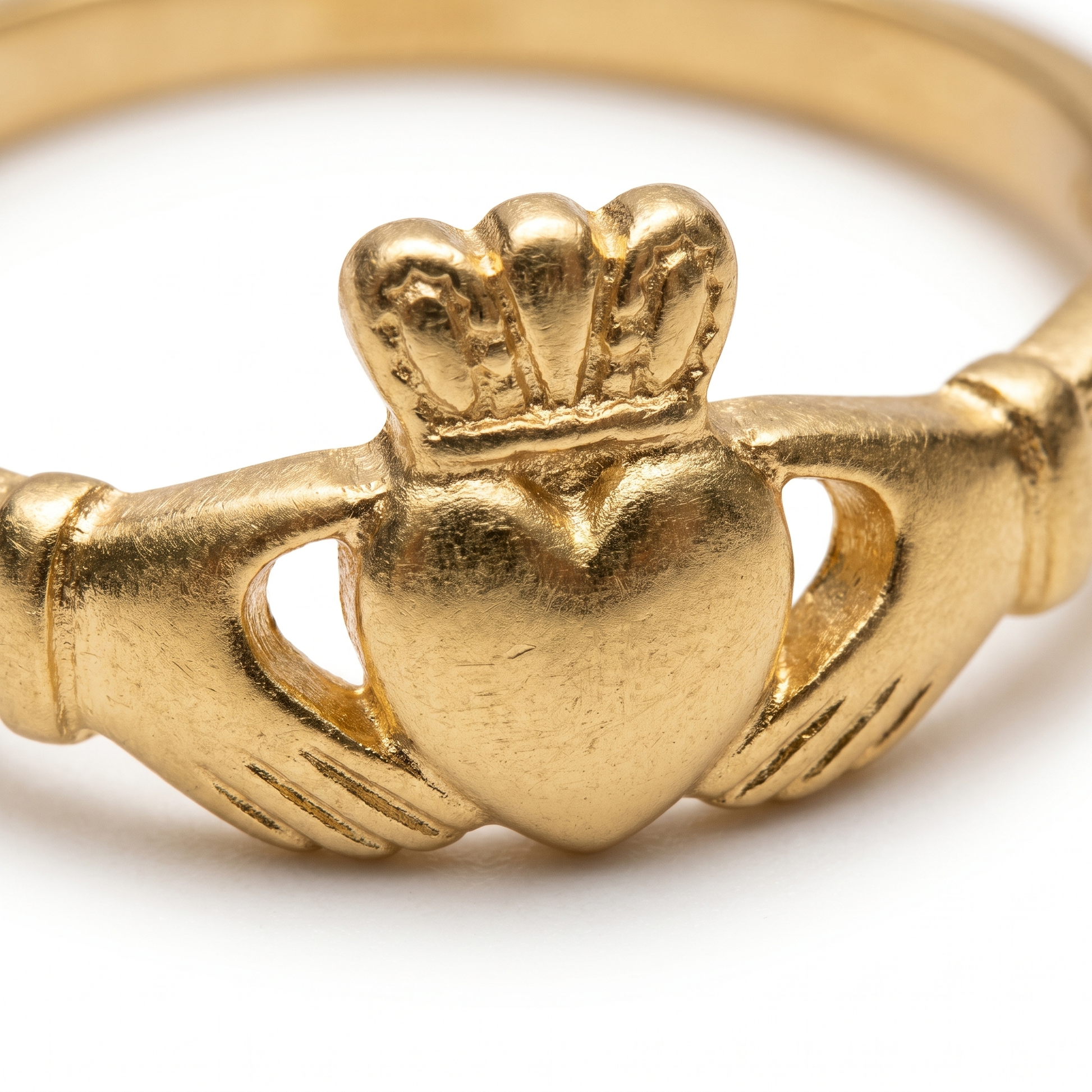 Close-up of crowned heart and hands