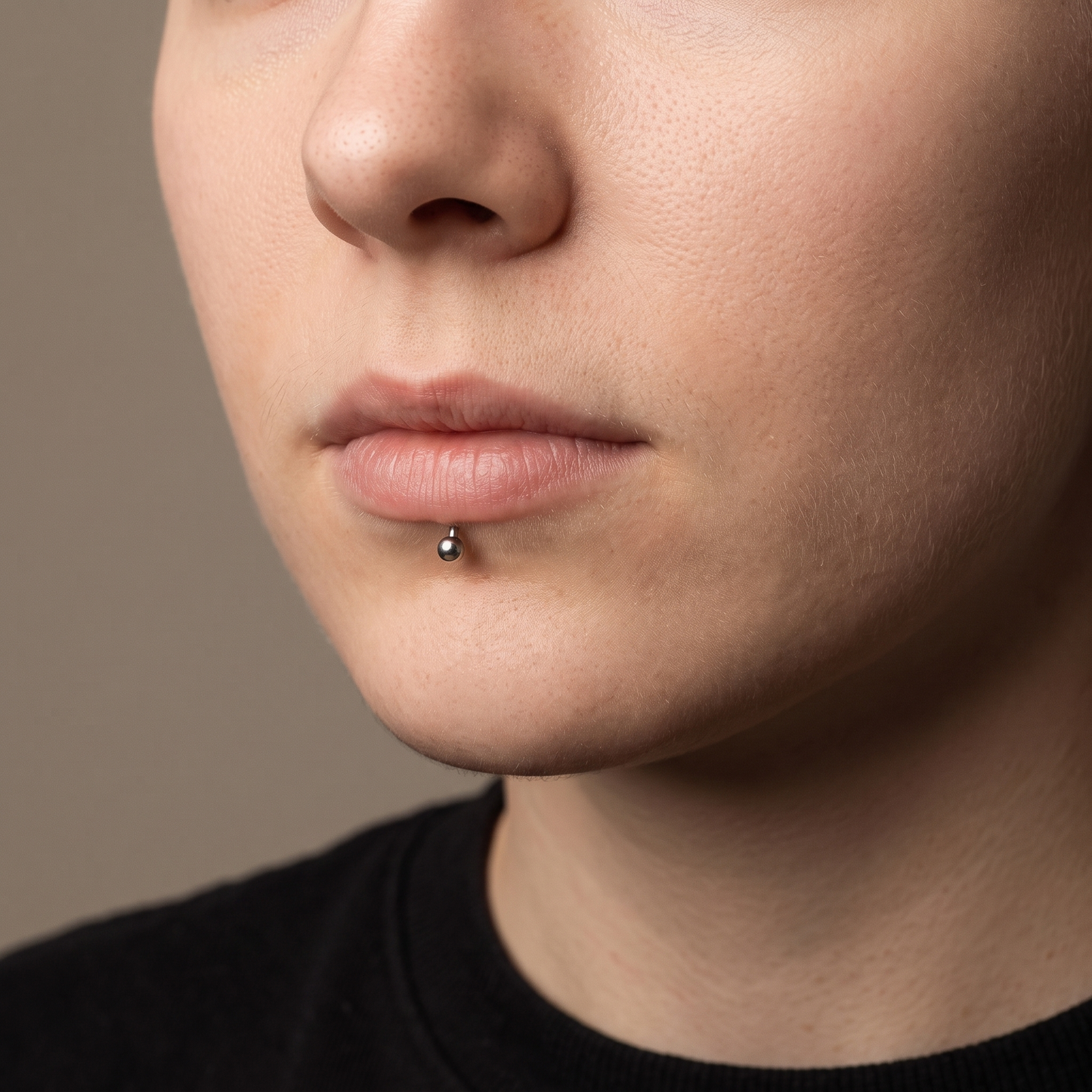 Labret stud worn below the lower lip