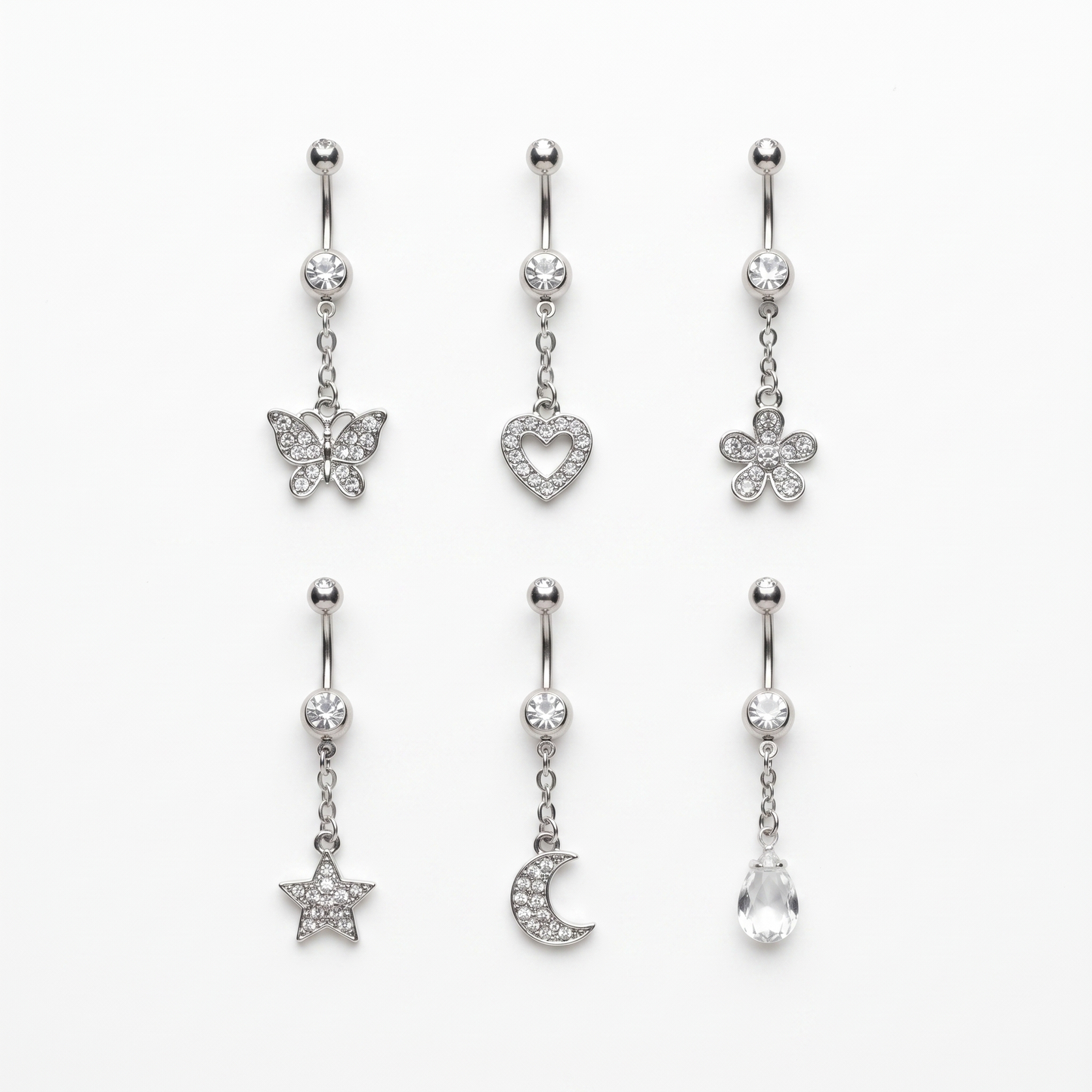 Six dangle belly ring styles laid out