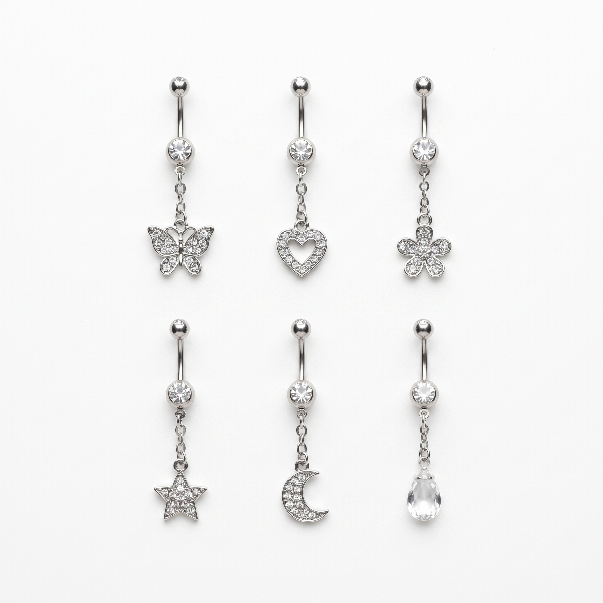Six dangle belly ring styles laid out