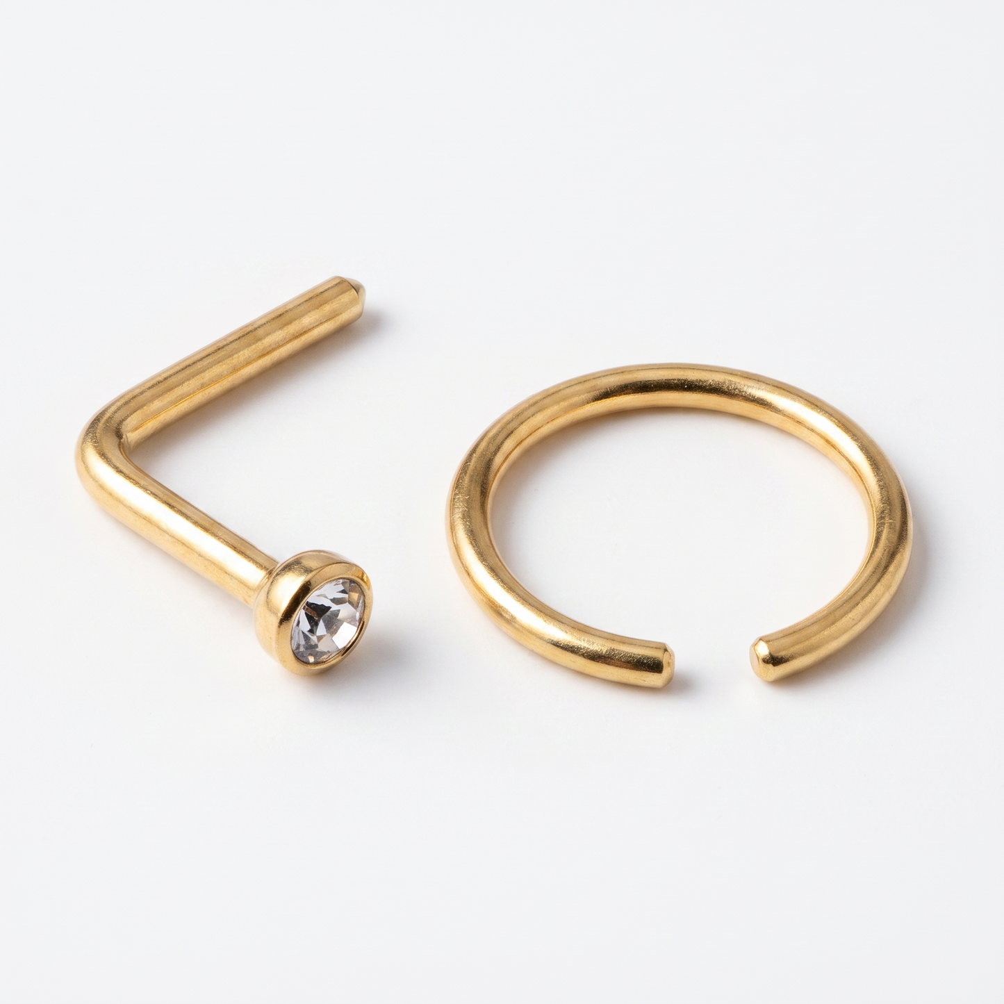 Close-up of an L-shaped stud and a nose hoop