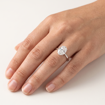Moissanite oval solitaire ring worn, front view