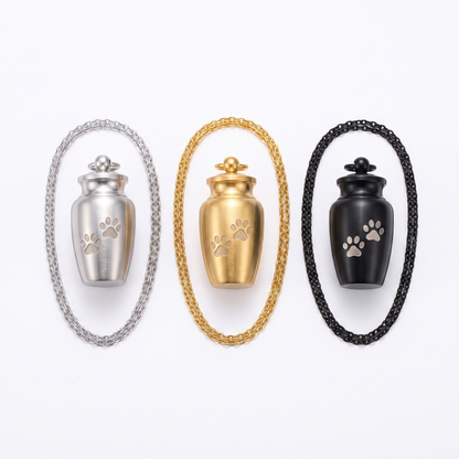 Urn pendant shown in silver, gold, black