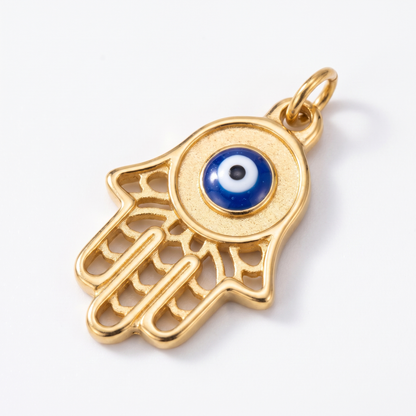 Close-up of hamsa pendant and evil eye