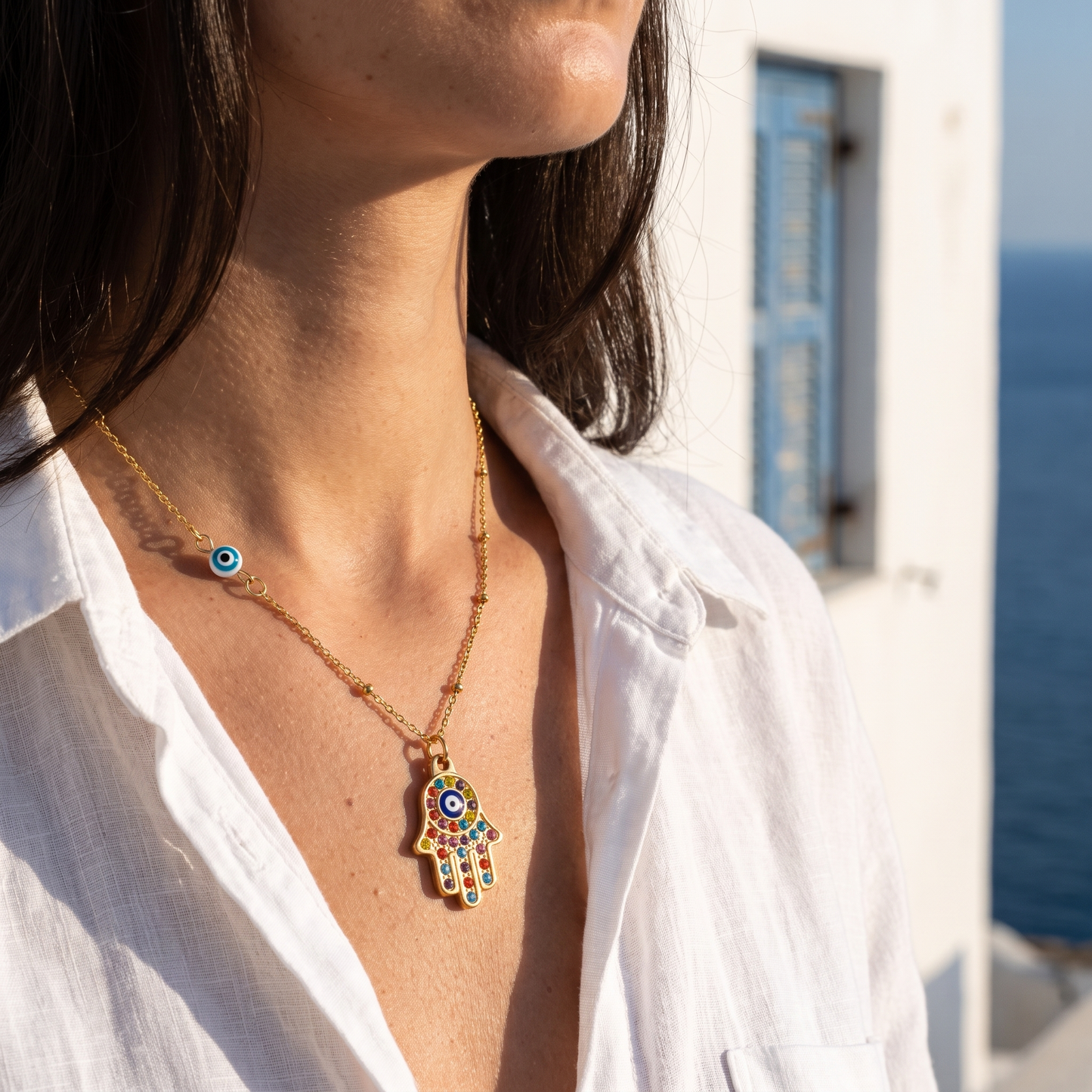 Hamsa evil eye necklace worn, front view
