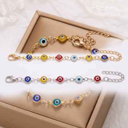 Evil eye bracelet shown in gold and silver