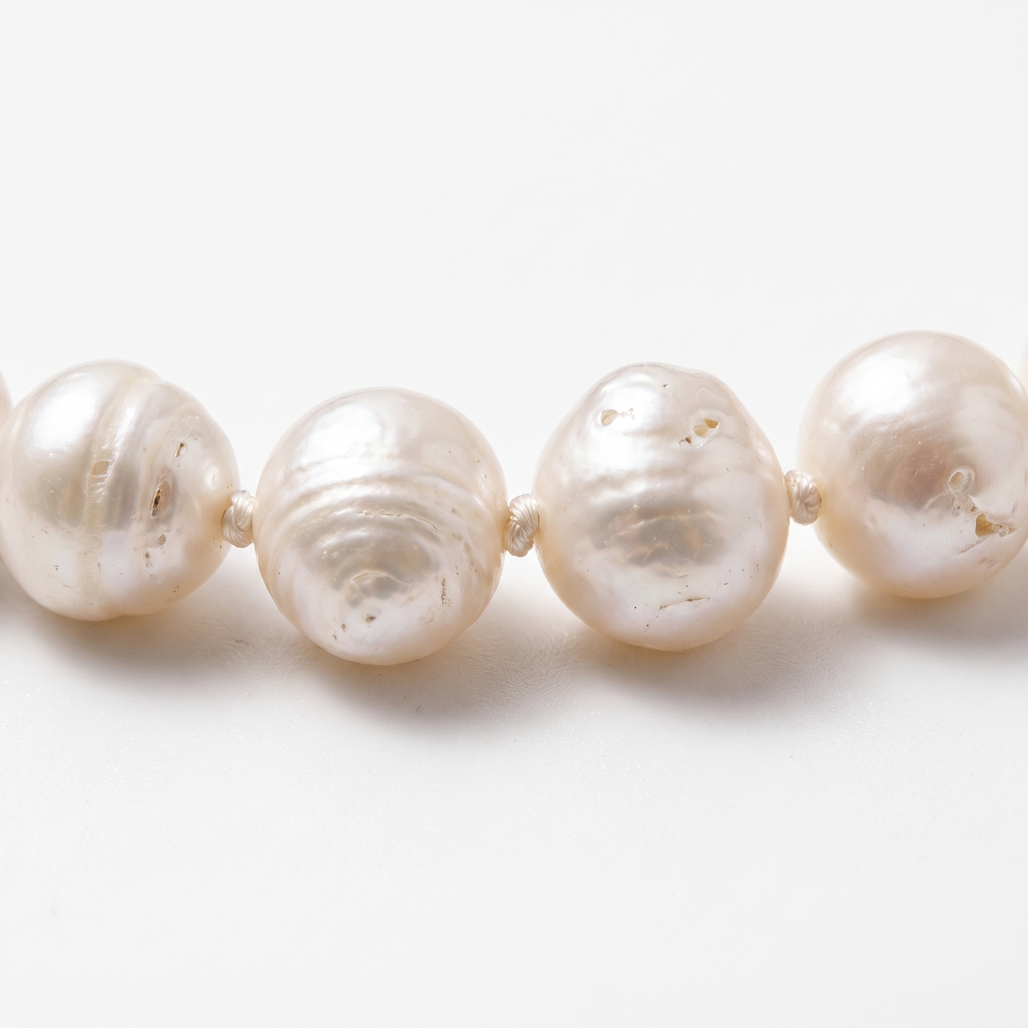 Close-up of knotting and pearl nacre