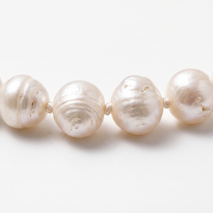 Close-up of knotting and pearl nacre
