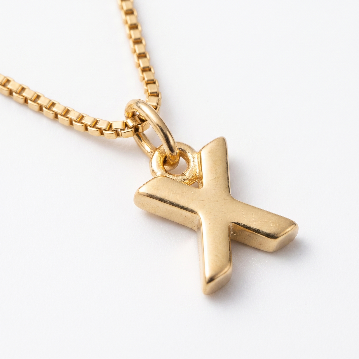 Close-up of letter pendant