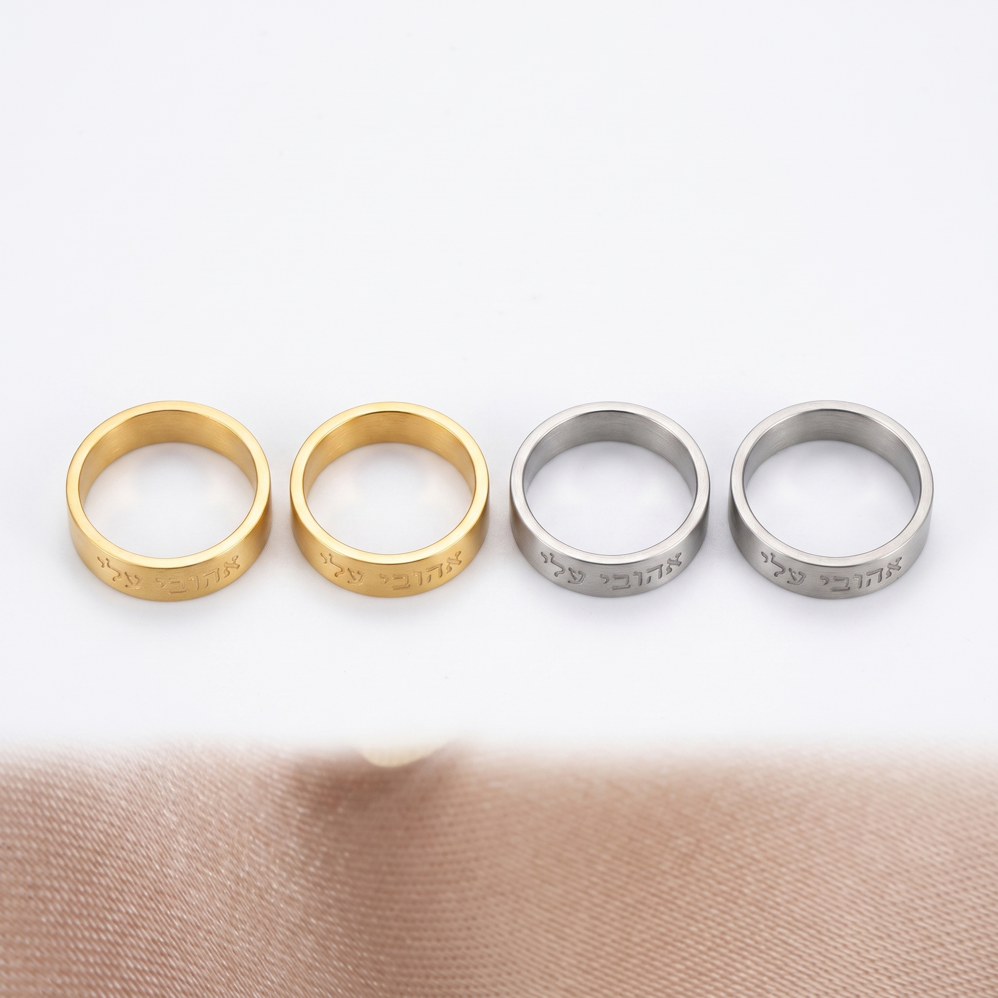 Hebrew band ring shown in four finishes