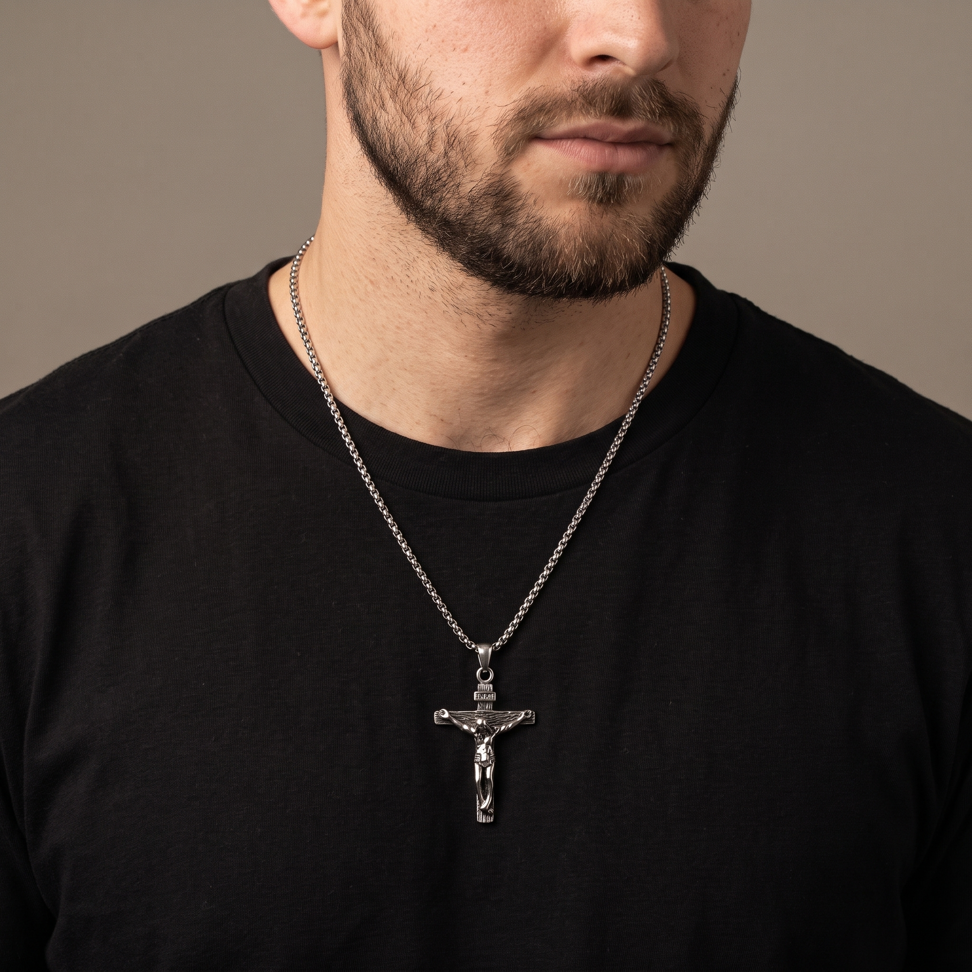 Crucifix pendant necklace worn, front view