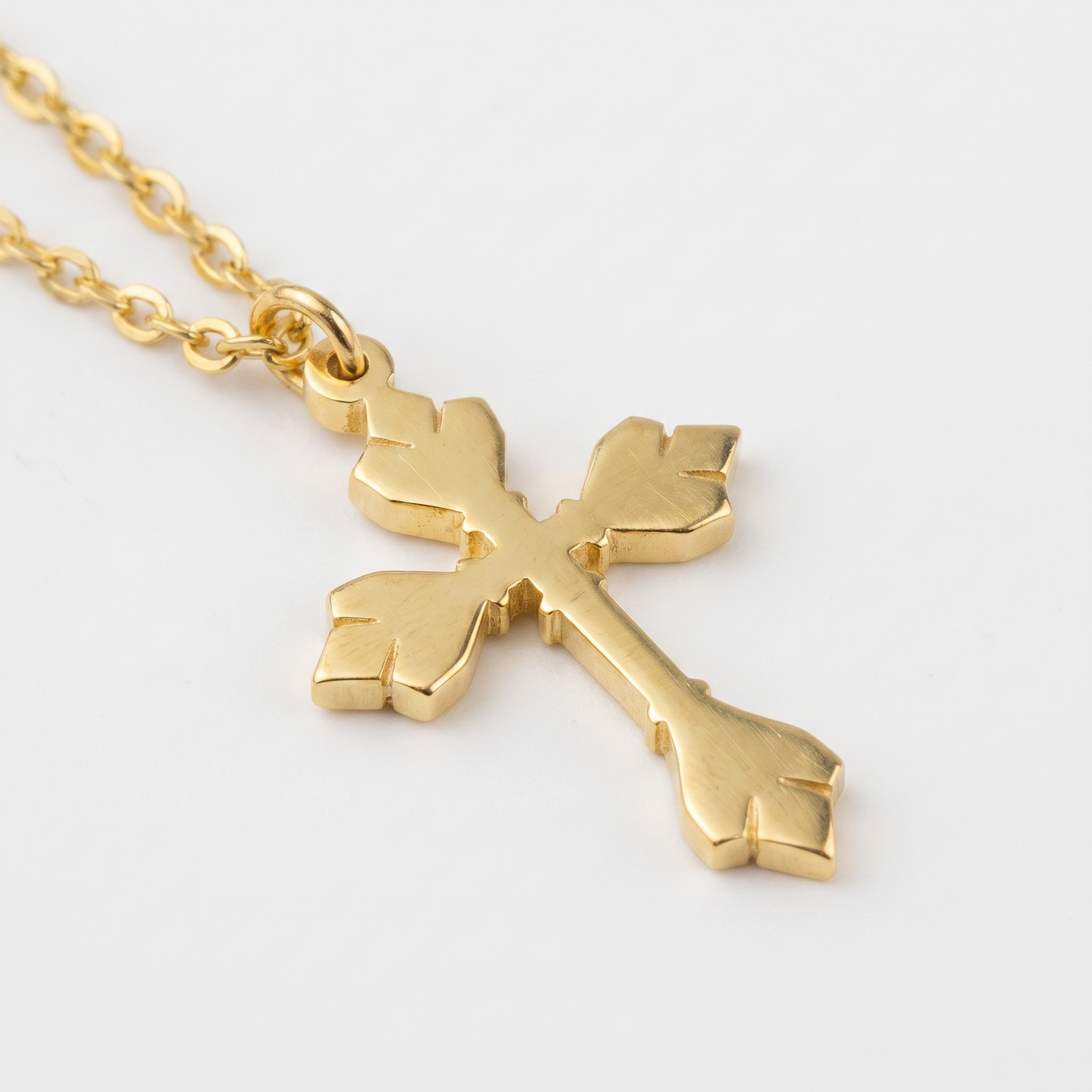 Close-up of cross and O-link chain