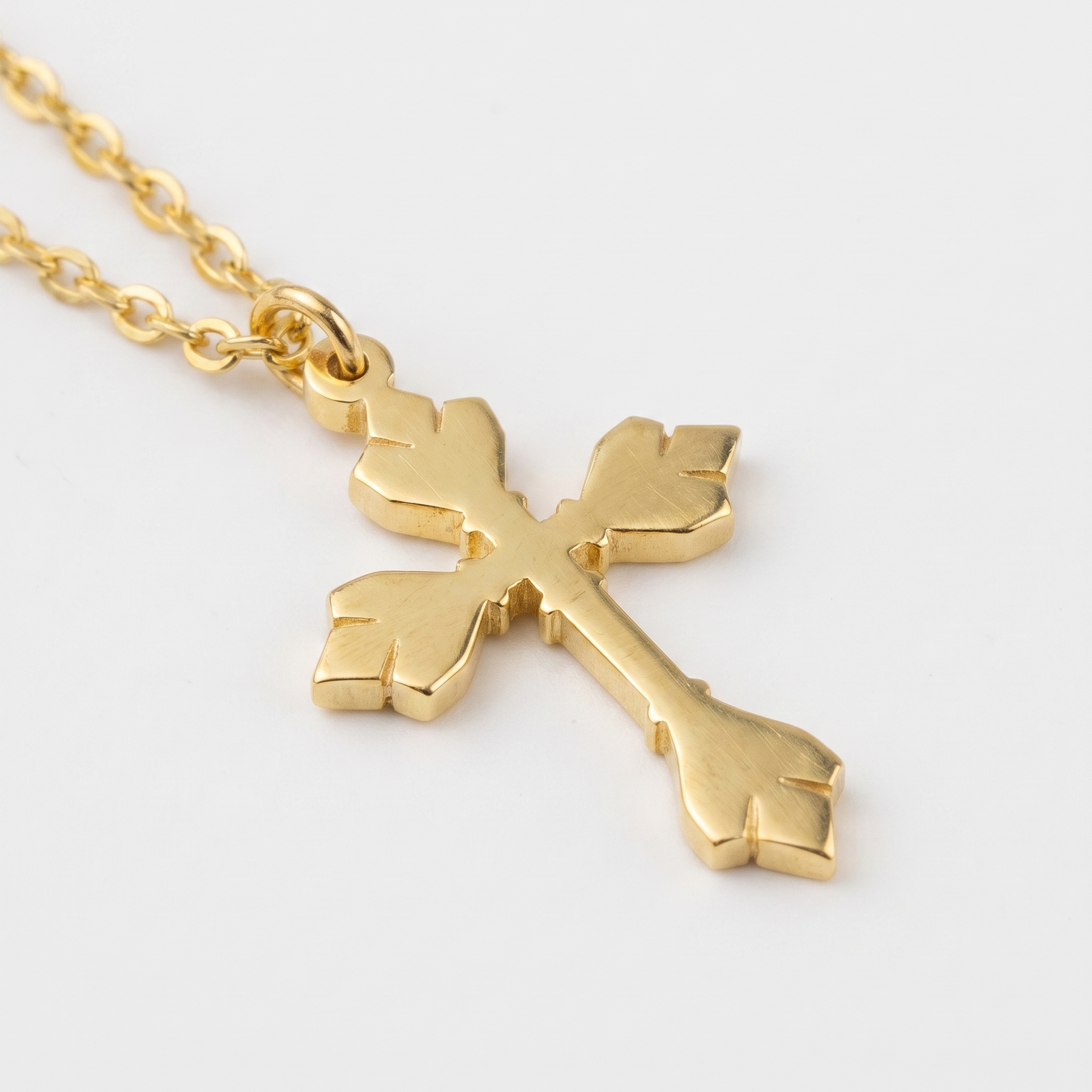 Close-up of cross and O-link chain