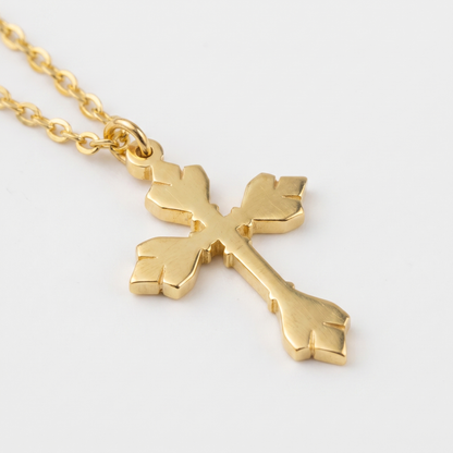 Close-up of cross and O-link chain