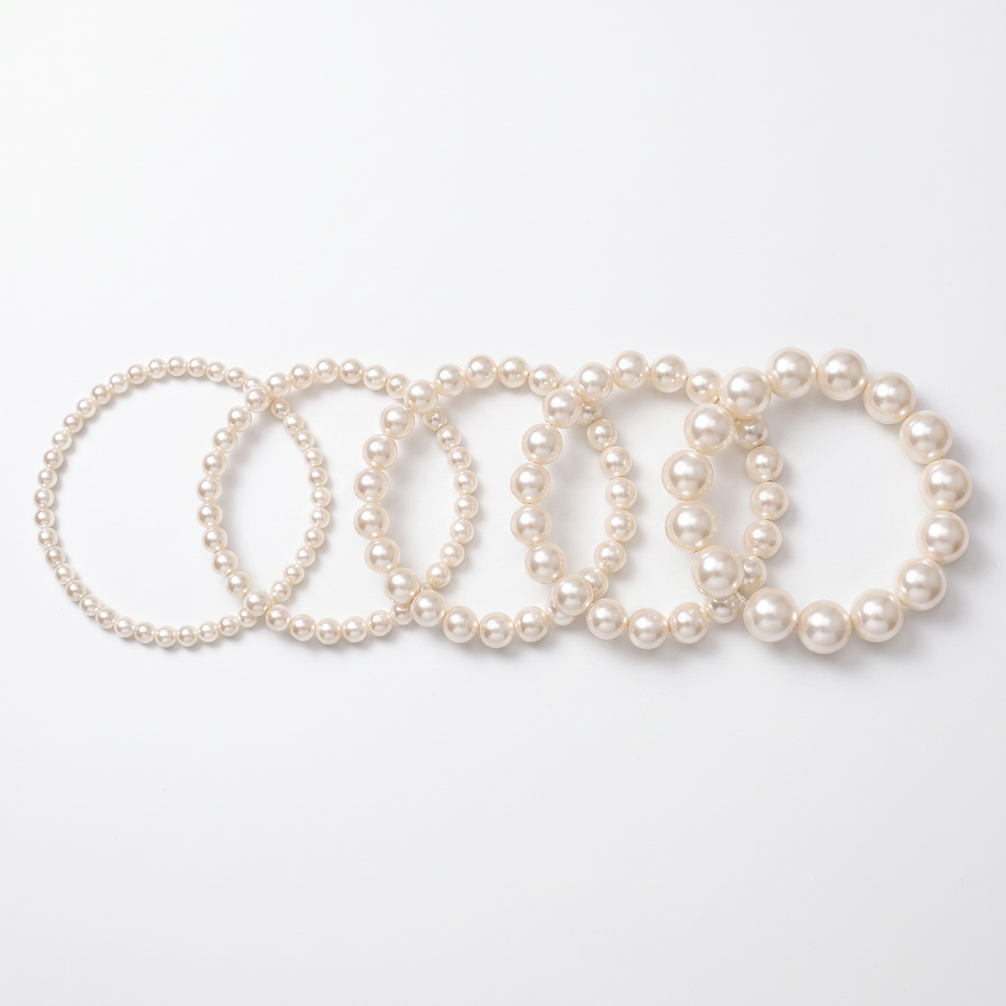 Pearl chokers shown in five bead sizes