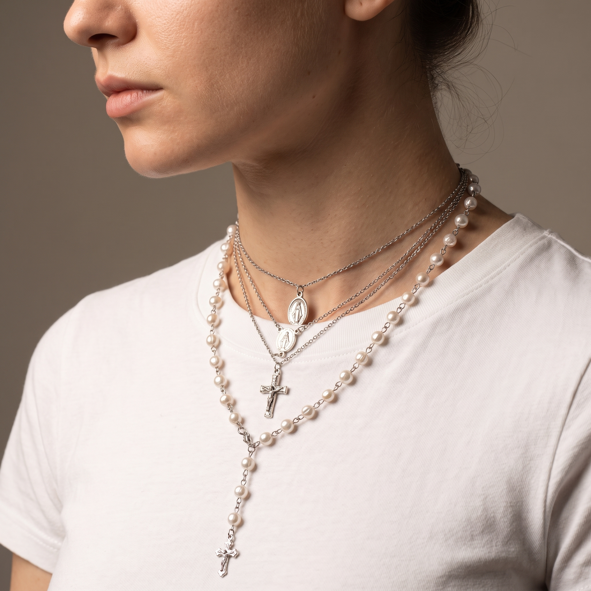 Layered pearl cross necklace worn, second angle