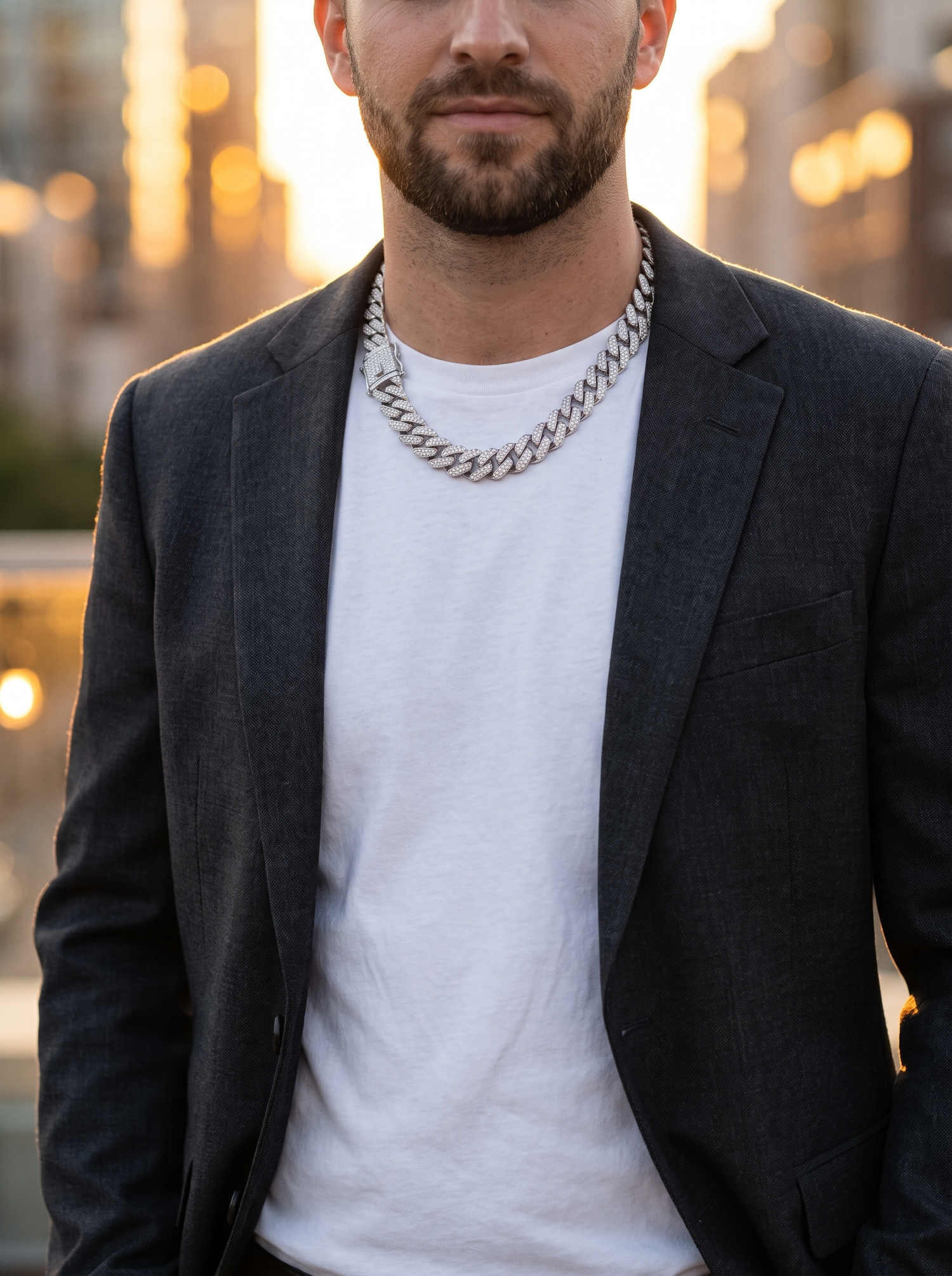 Aurelle 14mm Cuban link chain worn over a white tee