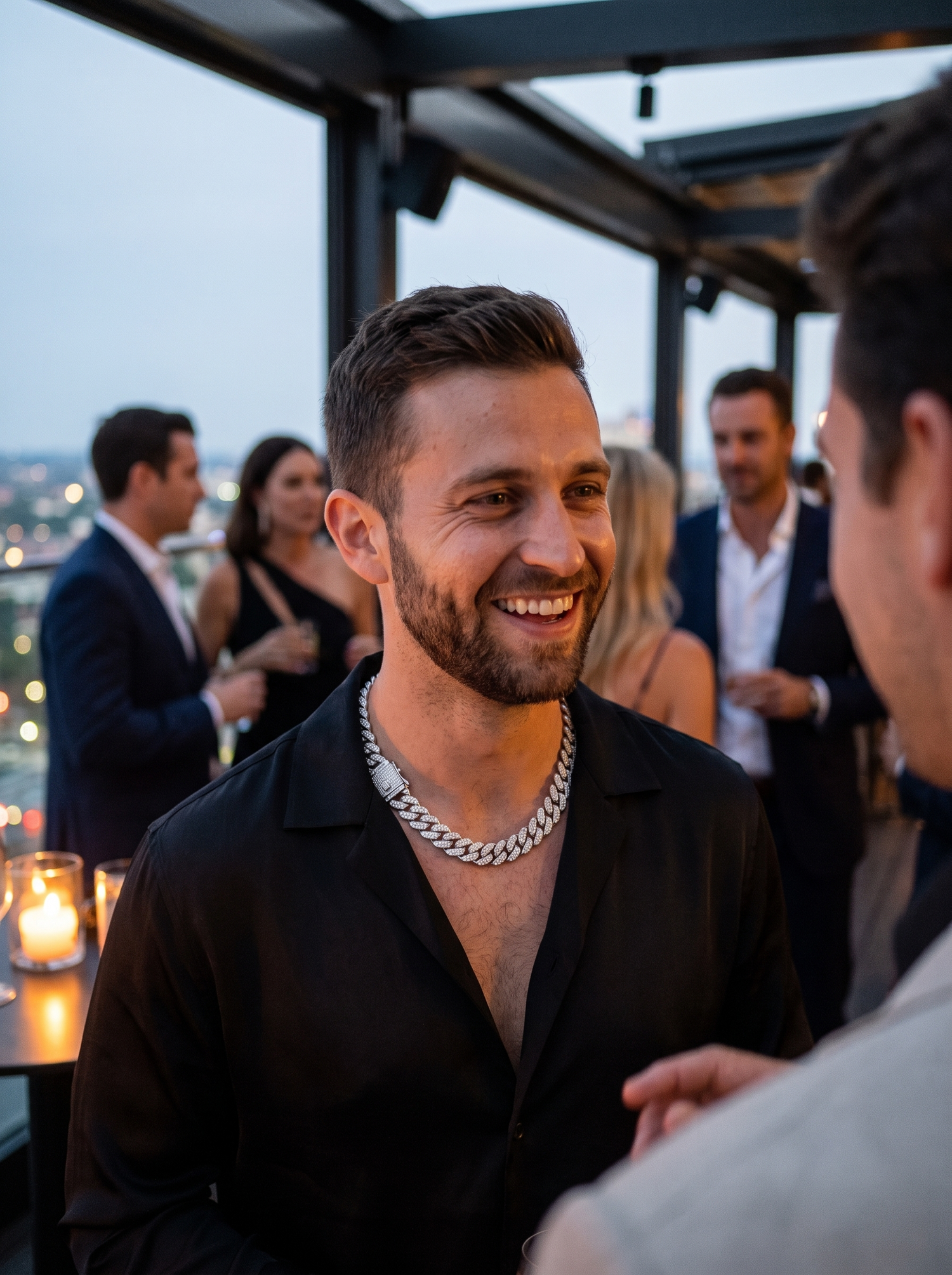 Aurelle Cuban link chain worn at an evening rooftop bar
